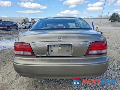 Zdjęcie 6 z 12 samochodu: 1998 MAZDA 626 DX VIN:1YVGF22C8W5773403 - miniatura