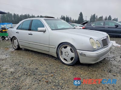 Czwarte zdjęcie samochodu z boku: 1999 MERCEDES-BENZ E 55 AMG VIN:WDBJF74H2XA908156 - miniatura