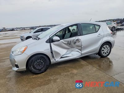2014 TOYOTA PRIUS C ONE JTDKDTB37E1064558 - główne zdjęcie licytacji z USA - miniatura