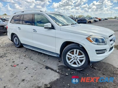 Czwarte zdjęcie samochodu z boku: 2016 MERCEDES-BENZ GL 450 4MATIC VIN:4JGDF6EE7GA705451 - miniatura