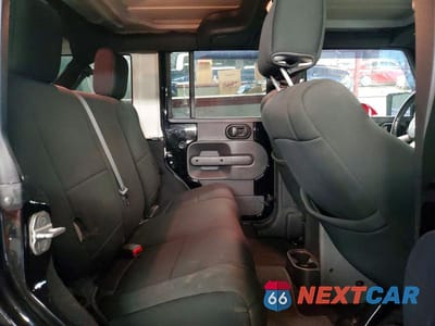 Zdjęcie 10 z 13 samochodu: 2010 JEEP WRANGLER UNLIMITED SAHARA VIN:1J4BA5H12AL122496 - miniatura