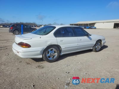 Trzecie zdjęcie samochodu z tyłu: 1999 PONTIAC BONNEVILLE SE VIN:1G2HX52K2XH233680 - miniatura
