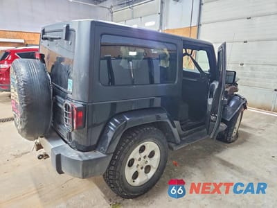 Trzecie zdjęcie samochodu z tyłu: 2014 JEEP WRANGLER SAHARA VIN:1C4AJWBG0EL219898 - miniatura