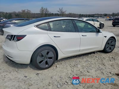 Trzecie zdjęcie samochodu z tyłu: 2023 TESLA MODEL 3 VIN:5YJ3E1EA2PF506785 - miniatura