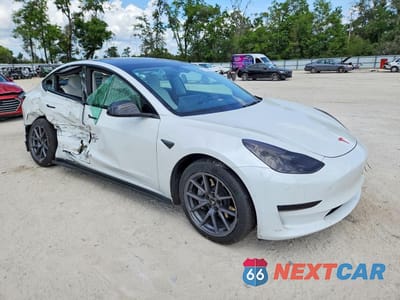 Czwarte zdjęcie samochodu z boku: 2022 TESLA MODEL 3 VIN:5YJ3E1EB9NF231244 - miniatura