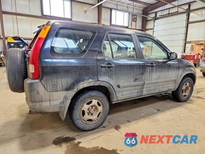 Trzecie zdjęcie samochodu z tyłu: 2002 HONDA CR-V LX VIN:JHLRD78412C812794 - miniatura
