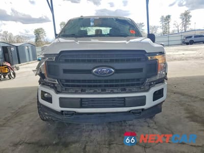 Piąte zdjęcie samochodu w środku: 2018 FORD F150 SUPERCREW VIN:1FTFW1E59JFE01404 - miniatura