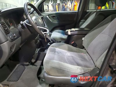 Zdjęcie 7 z 13 samochodu: 2003 MAZDA TRIBUTE LX VIN:4F2YZ941X3KM47248 - miniatura