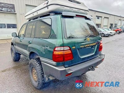 Trzecie zdjęcie samochodu z tyłu: 1999 TOYOTA LAND CRUISER BASE VIN:JT3HT05J4X0040771 - miniatura