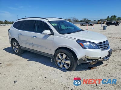 Czwarte zdjęcie samochodu z boku: 2016 CHEVROLET TRAVERSE LTZ VIN:1GNKRJKD7GJ212524 - miniatura