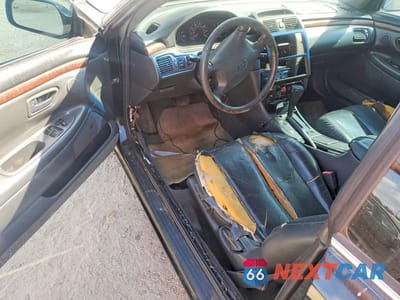 Zdjęcie 8 z 13 samochodu: 1999 TOYOTA CAMRY SOLARA SLE V6 VIN:2T1CF22P2XC210276 - miniatura