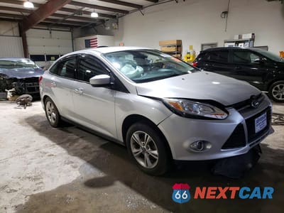 Czwarte zdjęcie samochodu z boku: 2012 FORD FOCUS SE VIN:1FAHP3F24CL181105 - miniatura