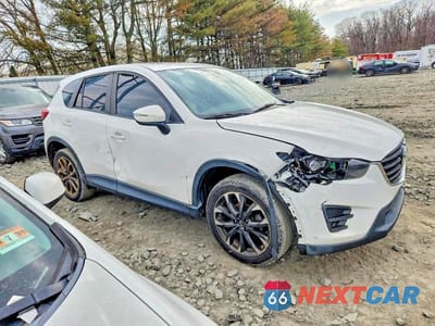 Czwarte zdjęcie samochodu z boku: 2016 MAZDA CX-5 GT VIN:JM3KE4DY1G0732379 - miniatura