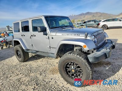 Czwarte zdjęcie samochodu z boku: 2014 JEEP WRANGLER UNLIMITED RUBICON VIN:1C4BJWFG9EL186317 - miniatura