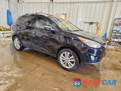 Czwarte zdjęcie samochodu z boku: 2011 HYUNDAI TUCSON LIMITED VIN:KM8JUCAC7BU290215 - miniatura