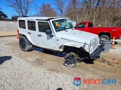 Czwarte zdjęcie samochodu z boku: 2016 JEEP WRANGLER UNLIMITED SAHARA VIN:1C4BJWEGXGL107869 - miniatura