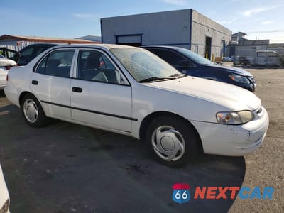 Czwarte zdjęcie samochodu z boku: 2000 TOYOTA COROLLA VE VIN:1NXBR12E2YZ346239 - miniatura
