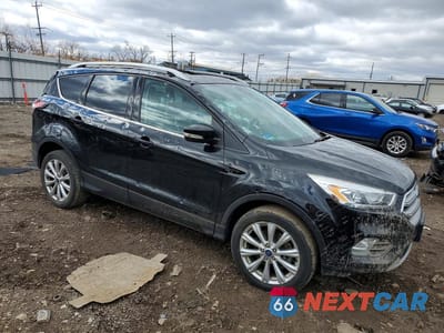 Czwarte zdjęcie samochodu z boku: 2017 FORD ESCAPE TITANIUM VIN:1FMCU9JD0HUC84866 - miniatura