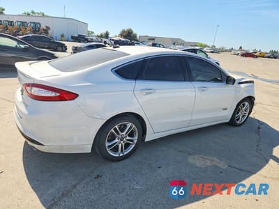 Trzecie zdjęcie samochodu z tyłu: 2016 FORD FUSION TITANIUM PHEV VIN:3FA6P0SU7GR106824 - miniatura