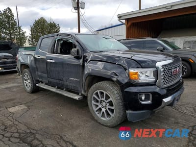 Czwarte zdjęcie samochodu z boku: 2018 GMC CANYON DENALI VIN:1GTG6EEN3J1223658 - miniatura