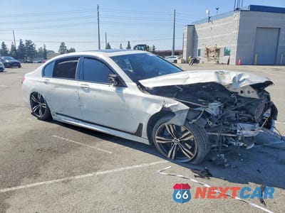 Czwarte zdjęcie samochodu z boku: 2018 BMW 750 I VIN:WBA7F0C55JGM23828 - miniatura