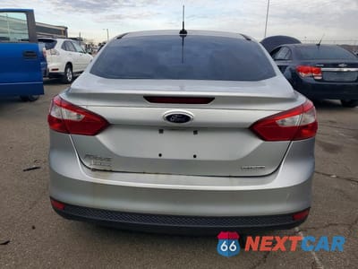 Zdjęcie 6 z 11 samochodu: 2014 FORD FOCUS S VIN:1FADP3E27EL302115 - miniatura