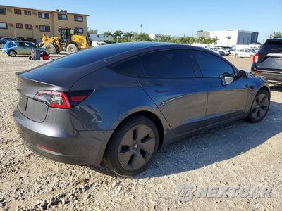 Trzecie zdjęcie samochodu z tyłu: 2023 TESLA MODEL 3 VIN:5YJ3E1EA0PF699390 - miniatura