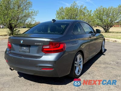 Czwarte zdjęcie samochodu z boku: 2014 BMW 228 I VIN:WBA1F5C51EV255559 - miniatura