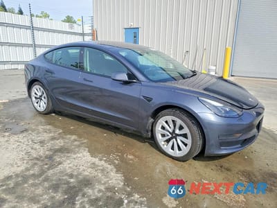 Czwarte zdjęcie samochodu z boku: 2022 TESLA MODEL 3 VIN:5YJ3E1EA1NF188364 - miniatura