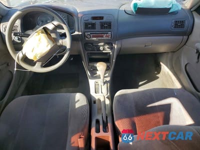 Zdjęcie 8 z 12 samochodu: 2001 TOYOTA COROLLA CE VIN:1NXBR12E11Z542629 - miniatura