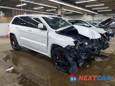 Czwarte zdjęcie samochodu z boku: 2014 JEEP GRAND CHEROKEE SRT-8 VIN:1C4RJFDJ0EC217645 - miniatura