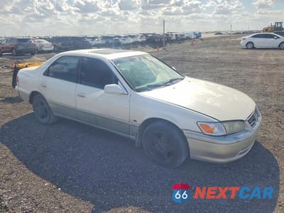 Czwarte zdjęcie samochodu z boku: 2001 TOYOTA CAMRY LE VIN:JT2BG22K010594520 - miniatura