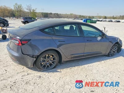 Trzecie zdjęcie samochodu z tyłu: 2023 TESLA MODEL 3 VIN:5YJ3E1EA4PF428283 - miniatura