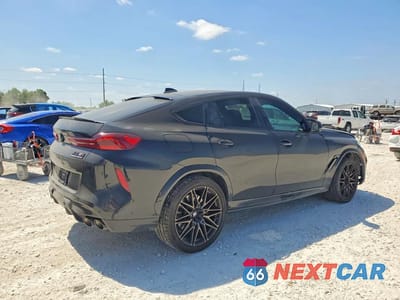 Trzecie zdjęcie samochodu z tyłu: 2022 BMW X6 M VIN:5YMCY0C09N9M45607 - miniatura