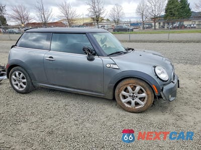 Czwarte zdjęcie samochodu z boku: 2010 MINI COOPER S VIN:WMWMF7C58ATZ34551 - miniatura