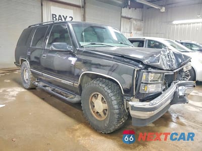 Czwarte zdjęcie samochodu z boku: 1999 GMC YUKON VIN:1GKEC13R9XJ793112 - miniatura