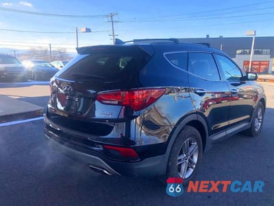 Czwarte zdjęcie samochodu z boku: 2017 HYUNDAI SANTA FE SPORT VIN:5NMZUDLB0HH023306 - miniatura