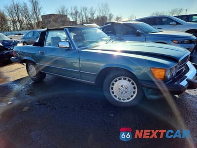 Czwarte zdjęcie samochodu z boku: 1987 MERCEDES-BENZ 560 SL VIN:WDBBA48D9HA064479 - miniatura