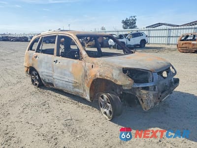 Czwarte zdjęcie samochodu z boku: 2003 TOYOTA RAV4 BASE VIN:JTEGH20V930097780 - miniatura