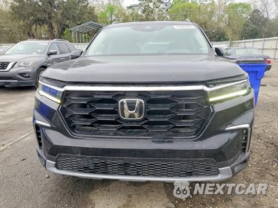 Piąte zdjęcie samochodu w środku: 2023 HONDA PILOT TOURING VIN:5FNYG2H74PB014250 - miniatura
