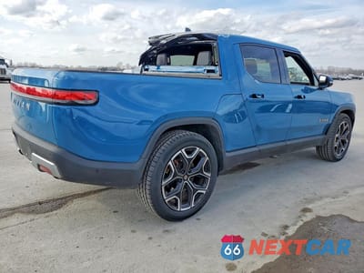 Trzecie zdjęcie samochodu z tyłu: 2023 RIVIAN R1T ADVENTURE VIN:7FCTGAAA1PN018200 - miniatura