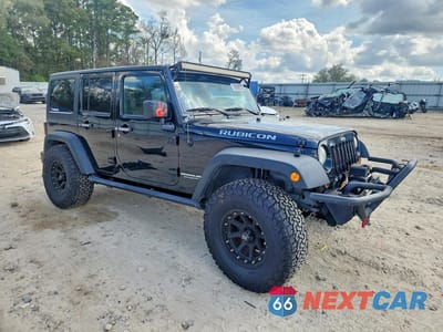 Czwarte zdjęcie samochodu z boku: 2011 JEEP WRANGLER UNLIMITED RUBICON VIN:1J4HA6H13BL585863 - miniatura