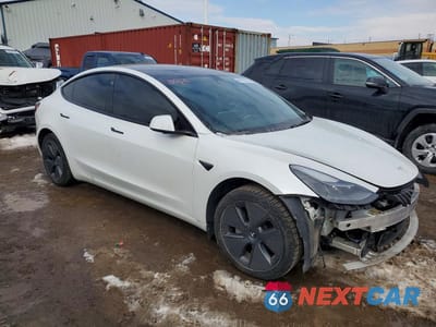 Czwarte zdjęcie samochodu z boku: 2022 TESLA MODEL 3 VIN:5YJ3E1EB8NF120071 - miniatura