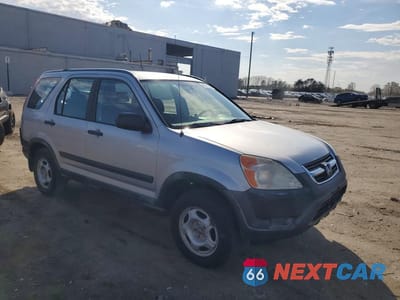 Czwarte zdjęcie samochodu z boku: 2002 HONDA CR-V LX VIN:JHLRD78462C075303 - miniatura