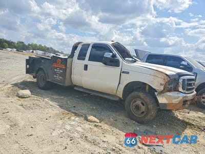 Czwarte zdjęcie samochodu z boku: 1999 FORD F350 SUPER DUTY FLATBED TRUCK VIN:1FDWX37F5XEB35128 - miniatura