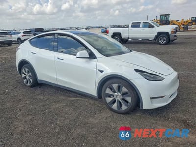 Czwarte zdjęcie samochodu z boku: 2022 TESLA MODEL Y VIN:7SAYGAEE7NF521463 - miniatura