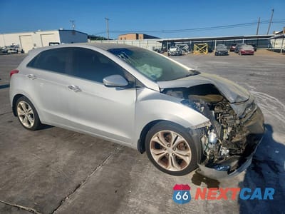 Czwarte zdjęcie samochodu z boku: 2014 HYUNDAI ELANTRA GT BASE VIN:KMHD35LH1EU208231 - miniatura