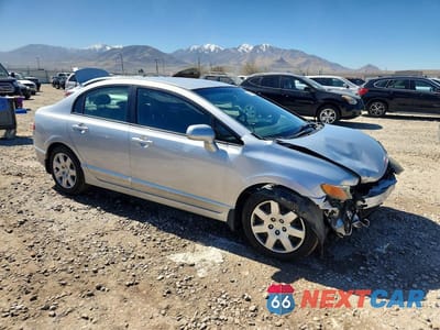 Czwarte zdjęcie samochodu z boku: 2006 HONDA CIVIC LX VIN:1HGFA16556L147942 - miniatura