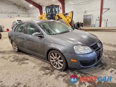 Czwarte zdjęcie samochodu z boku: 2010 VOLKSWAGEN JETTA LIMITED VIN:3VWAZ7AJ4AM075371 - miniatura