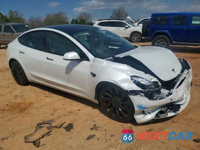 Czwarte zdjęcie samochodu z boku: 2023 TESLA MODEL 3 VIN:5YJ3E1EC5PF477252 - miniatura